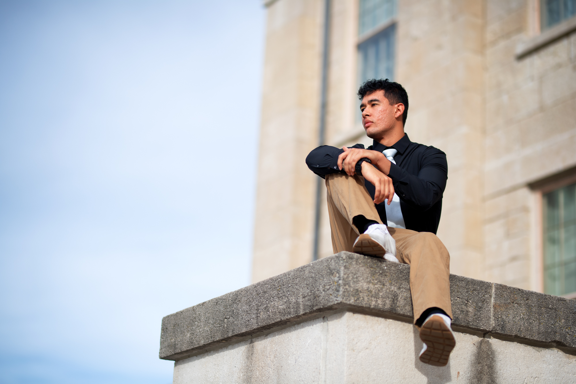 James Huerta sits on top of the Old Capitol Ledge looking beyond